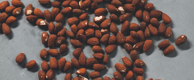 Roasted almonds ready to be ground into fresh butter for smoothies